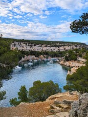 boats moored by stunning cliffs