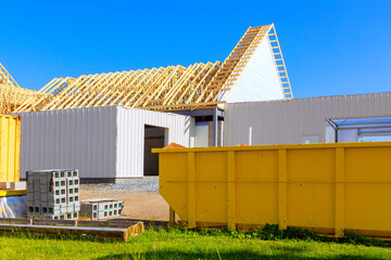 On construction site, metal containers are used to store waste during construction