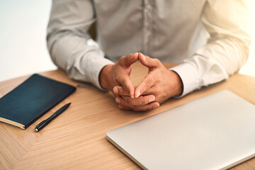 Hands, book and person at desk in office by laptop, meeting or interview at agency for advice. Manager, onboarding and human resources for recruitment with computer, notebook or business consultation