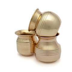 Different types of brass 'Kalash' (lota), a traditional globular water containers, placed on a...