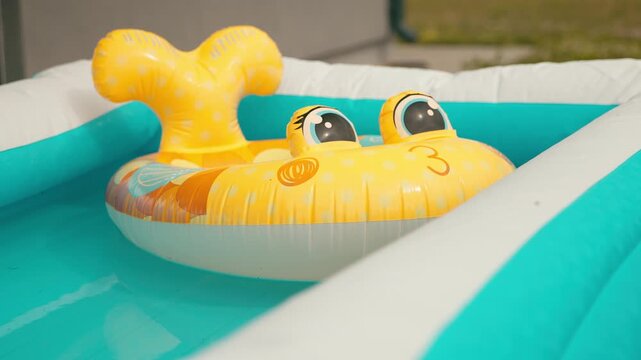 Handheld Video of Fun Yellow Pool Float for Kids