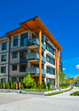 Brand new apartment building on sunny day in British Columbia, Canada.