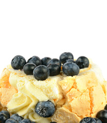 Meringue cake with blueberries isolated on white.