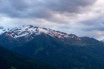 Landscape of valley with fog in the austrian village Bramberg near the mountain Wildkogel