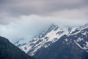 Landscape of valley with fog in the austrian village Bramberg near the mountain Wildkogel
