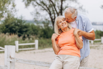 Fototapeta premium Happy Senior Couple Embracing Outdoors, Elderly Love and Affection in Nature