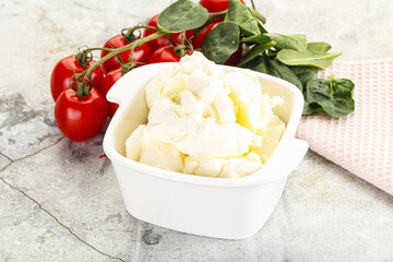 Soft cream cheese in the bowl