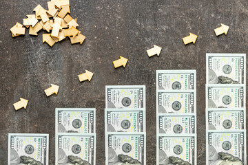 A rising scale composed of 100 dollar bills that symbolize growth and success. financial concept