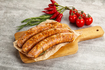 Raw sausages with spices and herbs