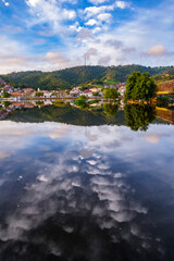 Fototapeta premium Bridge that crosses the city of Cachoeira in Bahia, and the beautiful sky and boats on the river