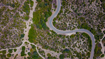 Italian panorama of a typical Sardinian coast with small mountains and roads
