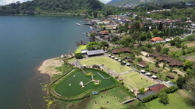 Ulun Danu Beratan Temple in Bali, a popular temple among tourists in the center of Bali island, drone view of the temple and surrounding area