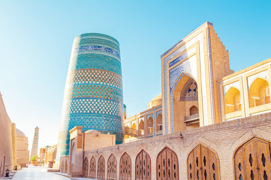 Kalta Minor minaret at sunrise. UNESCO cultural heritage site. Itchan Kala, inner town of the city of Khiva, Uzbekistan - July 22, 2024.