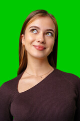 Young Woman Wearing Brown Sweater Looks Up