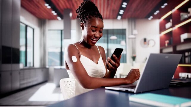 Woman Testing Glucose Level With Continuous Glucose Monitor