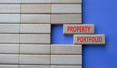 Property Portfolio symbol. Concept word Property Portfolio on wooden blocks. Beautiful purple background. Business and Property Portfolio concept. Copy space