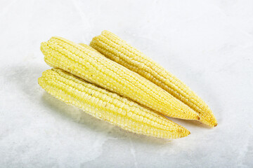 Raw sweet baby corn heap