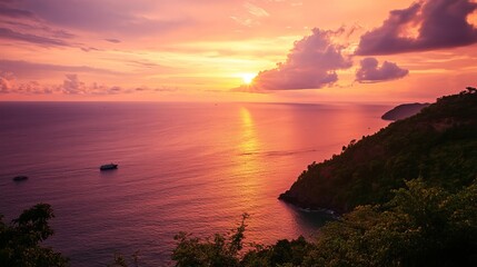 Pink and orange skies over ocean at sunset