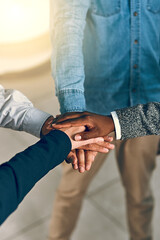Business people, hands together and unity with meeting for teamwork, collaboration or agreement at office. Closeup or group of employees piling in solidarity for motivation or mission at workplace
