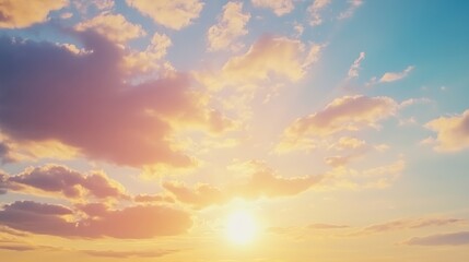 Golden sunset with fluffy clouds and tranquil horizon.