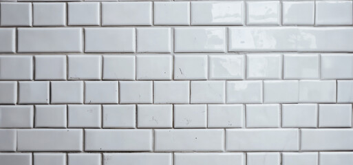 White Glossy Subway Tiles Forming A Seamless Pattern On A Kitchen Wall
