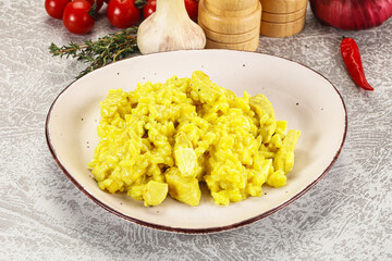 Italian cuisine - yellow risotto with chicken