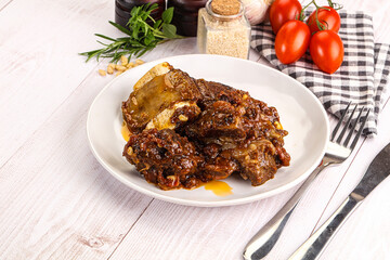 Prepared tasty beef ribs with sauce
