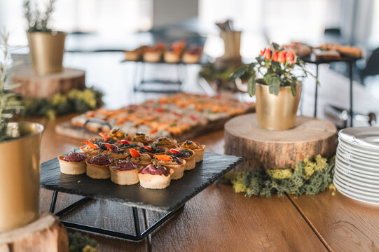Decorative finger foods on a styled table setup - Powered by Adobe