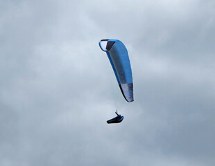  Paraglider flying in a cloudy sky