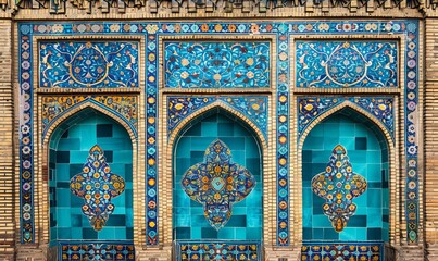 Traditional Persian mosaic wall with geometric and floral designs in Iran Blue ceramic tile background for text
