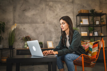 Adult young caucasian woman use lap top at home enjoy, hobby, rest