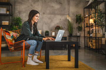 Adult young caucasian woman use lap top at home enjoy, hobby, rest