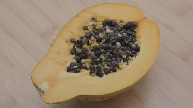 Papaya cut in have and rotating  