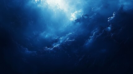 Dramatic Blue Clouds Illuminated by Sunlight in the Sky at Dawn