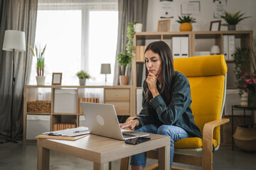 Adult young caucasian woman work from home and use laptop