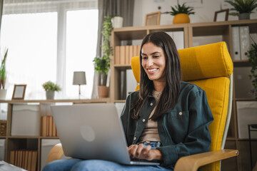 Adult young caucasian woman work from home and use laptop