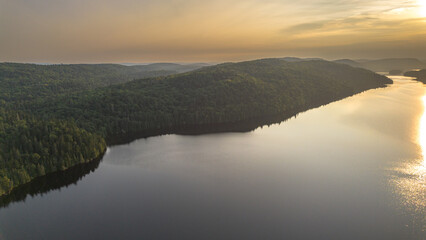 Fototapeta premium Sunset over a magnificent fishing lake in the Canadian forest