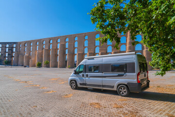 Motorhome campervan parked by Elvas Aqueduct Portugal Portuguese landmark