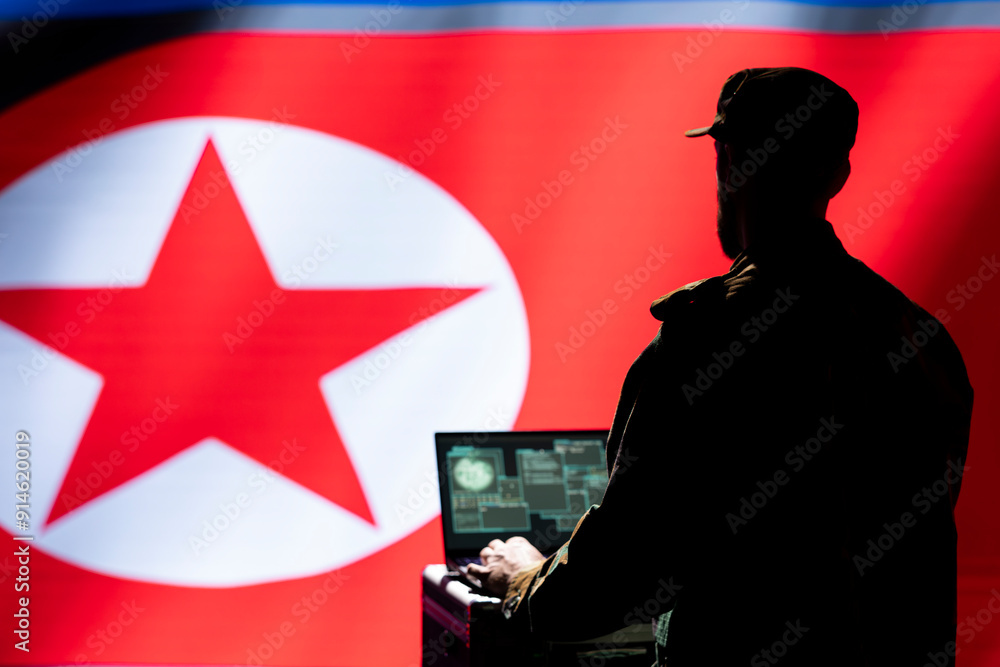 Poster army specialist working for pyongyang regime using target acquisition tech on laptop to detect enemy