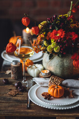 Atmospheric autumn elegant beautiful table setting with pumpkins for a wedding or thanksgiving...