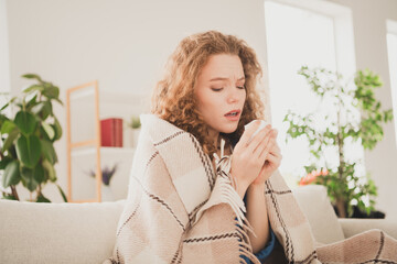 Photo of happy young girl feel sick wrapped blanket blue shirt apartment room light house flat indoor