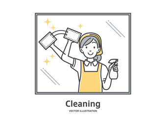 窓掃除をするエプロン姿の女性