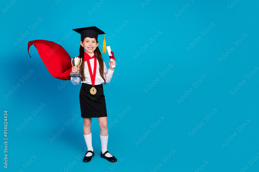 Sticker Full body portrait of little schoolkid uniform mortarboard diploma empty space isolated on blue color background