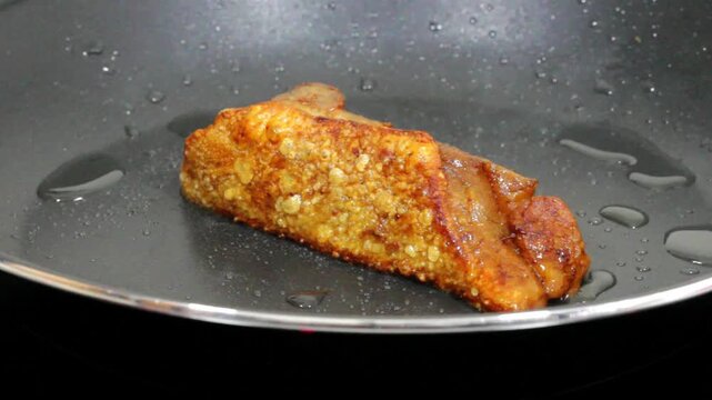Homemade pork rinds or chicharrones carnudos in Spanish, easy to make in a kitchen pan. They are crunchy, meaty and delicious.