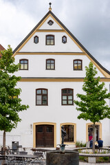Historic town house with fountain in Obere Hauptstraße in Freising, Bavaria, Germany