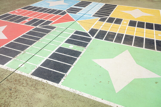 parchis board painted in a schoolyard, concept of back to school