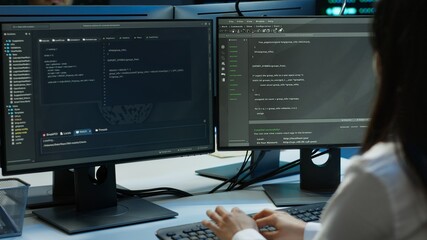 Software developer in data center ensuring system can handle networking tasks. IT professional in...
