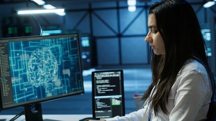 Admin does maintenance on server hub to optimize it for data processing requirements of artificial intelligence workloads. Expert inspects data center used for machine learning, camera A