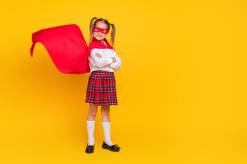 Full body photo of small schoolchild superhero costume uniform folded arms isolated on yellow color background