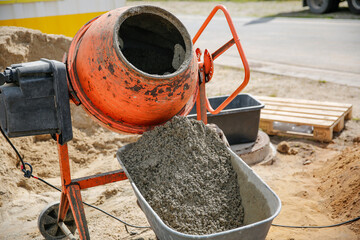 Concrete in an orange mixer on construction site
